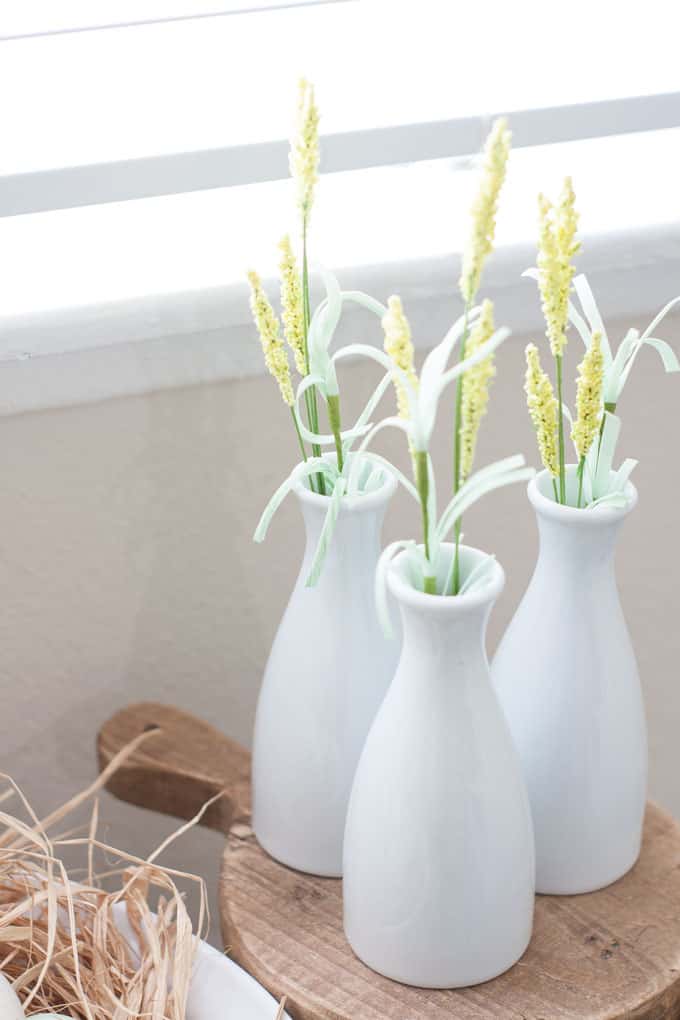 spring home tour decor ideas curating a home window bench with mini stool and white bottles