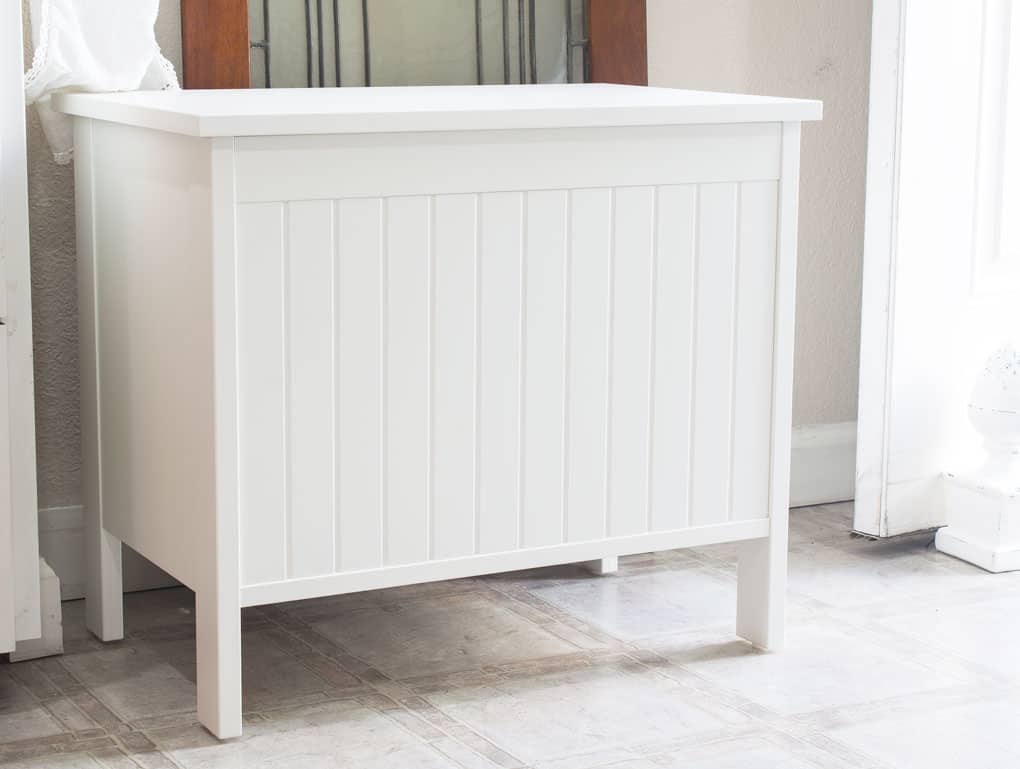 Closeup of an IKEA Silveran white storage bench