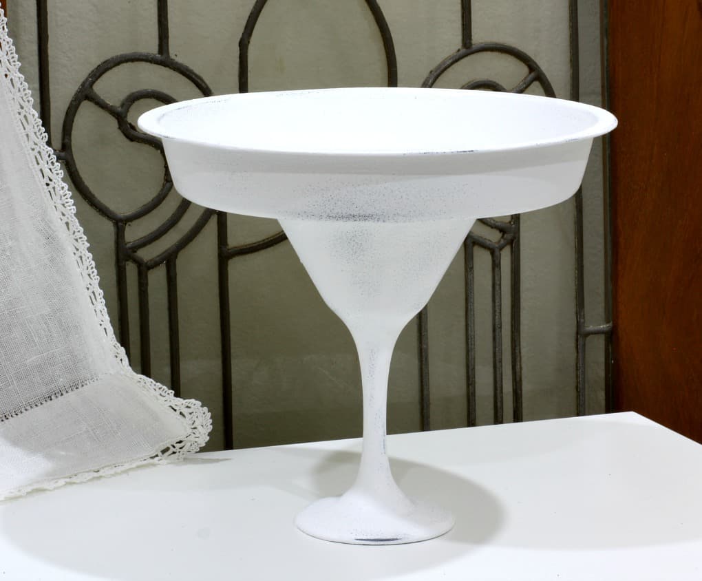 white pedestal bowl with leaded glass in background