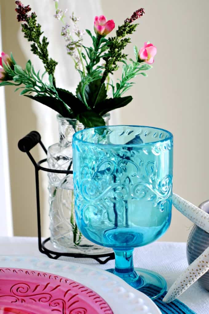 aqua goblet with flower vase and starfish