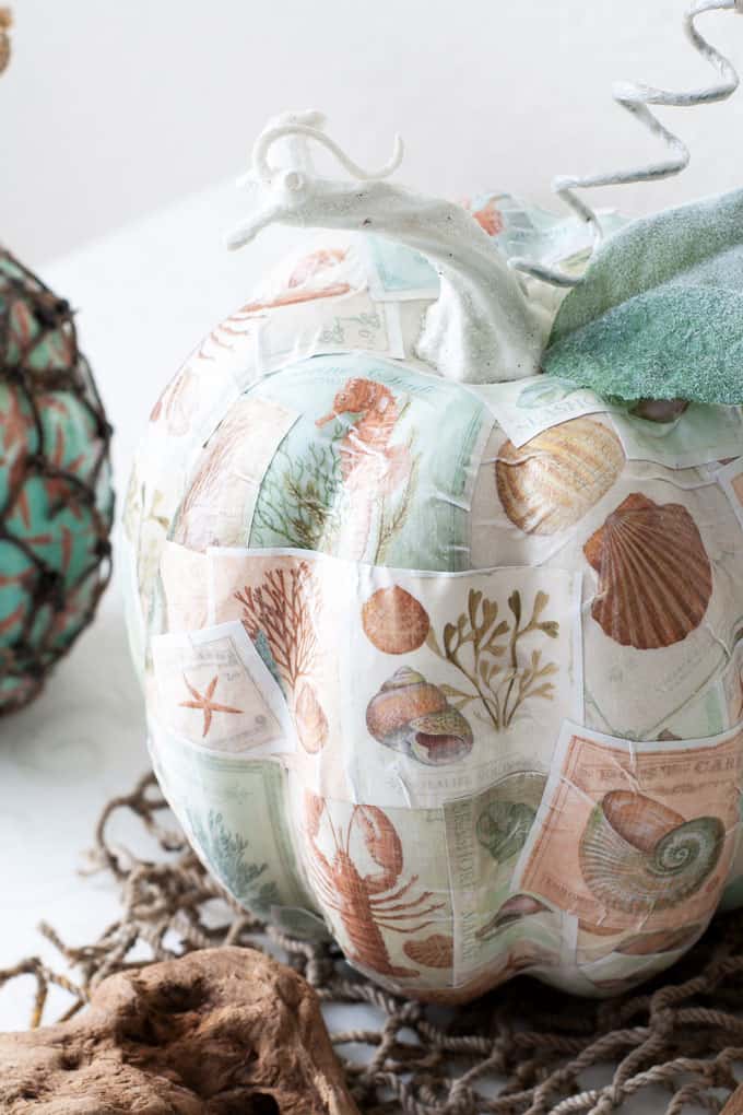 diy mod podge pumpkins coastal style pumpkin with coastal pattern and leaves and stem on white table
