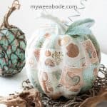 diy mod podge pumpkins coastal style pumpkins with coastal pattern and leaves and stem on white table