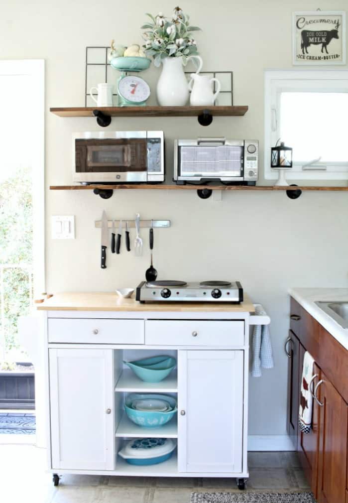 adding fall decor to a small kitchen small kitchen with cupboards open shelving portable island and decor items