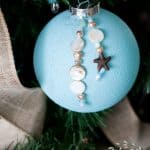 easy diy coastal christmas ornaments sea glass ornament with bead charms on tree with linen ribbon