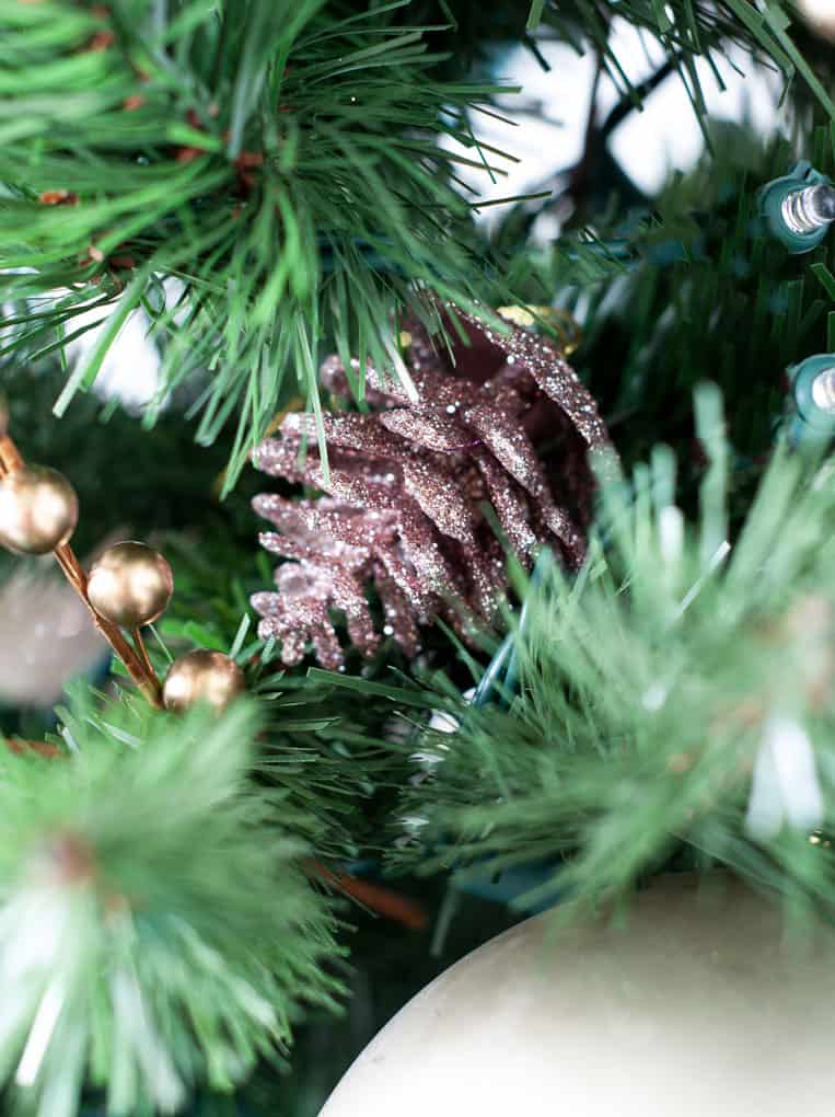 big ideas for decorating a small christmas tree with rose gold glitter pine cone
