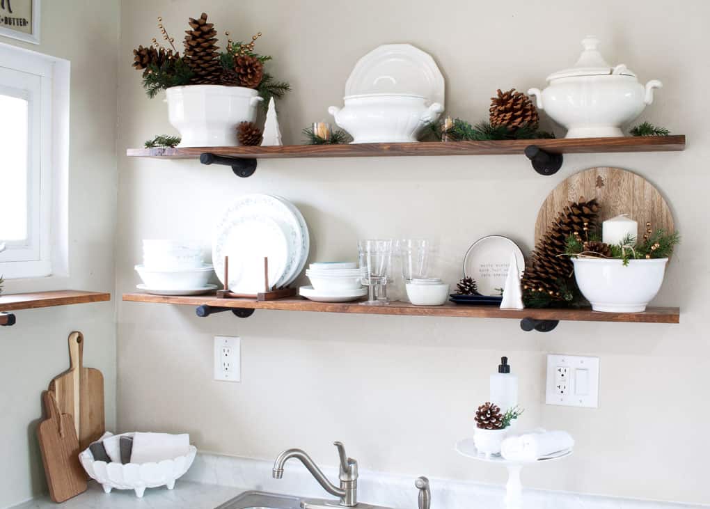 winter-valentine-decor-small-kitchen white dishes on open shelving in a kitchen