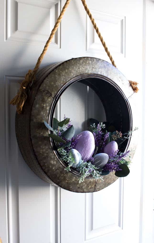 galvanized tire wreath with florals and velvet eggs