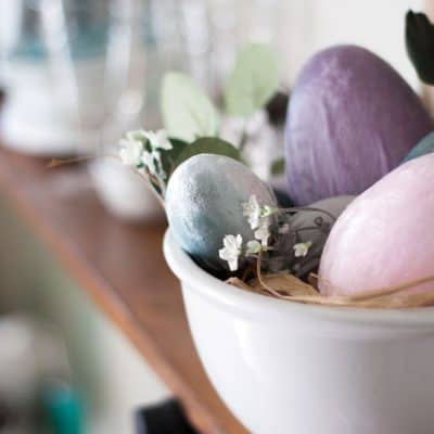 spring decorating ideas using velvet easter eggs bowl of velvet egs and faux flower on shelf