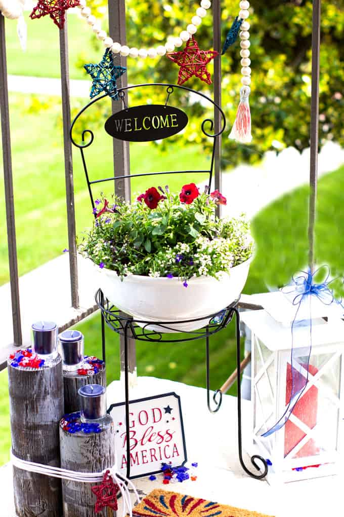 small porch decor red white blue with plants lantern candles and garland