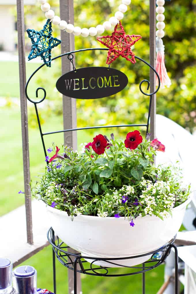 small porch 4th july decor ideas with plants lantern candles and garland