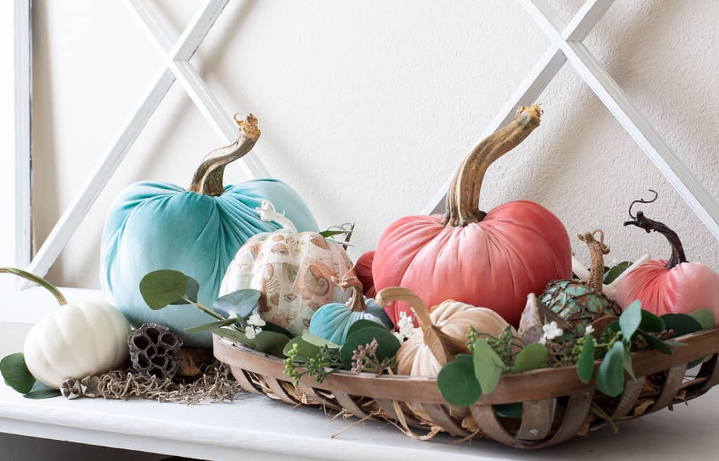 diy velvet pumpkins against a wooden window pane backdrop