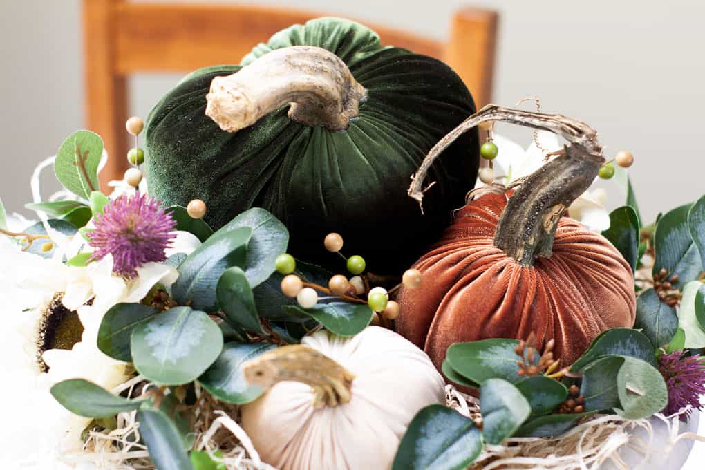 thanksgiving centerpiece with velvet pumpkins and faux foliage