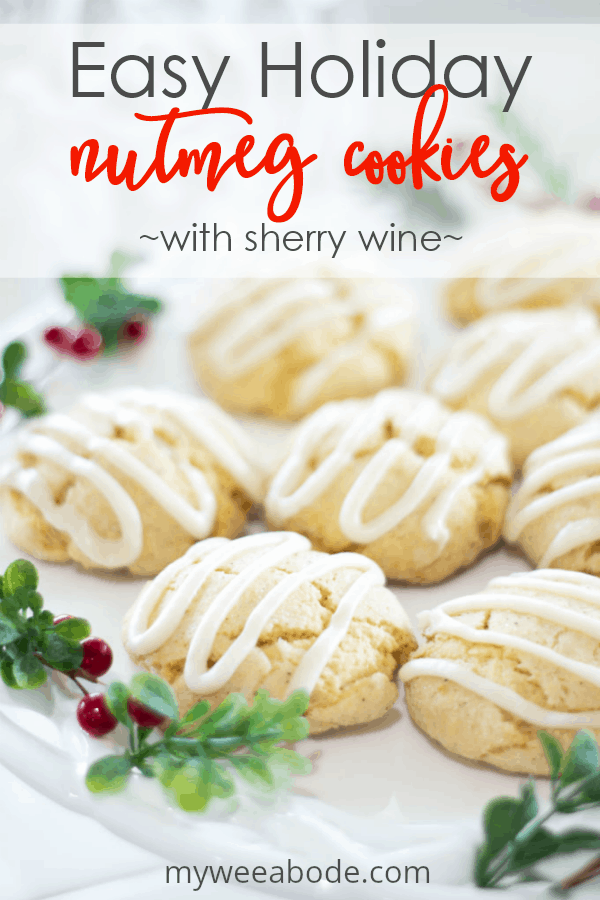 easy holiday nutmeg cookies on cake plate with berries and greenery