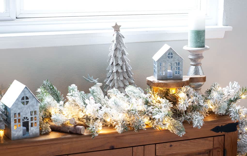 christmas mantel flocked garland window bench with flocked garland and Christmas decor elements in living room