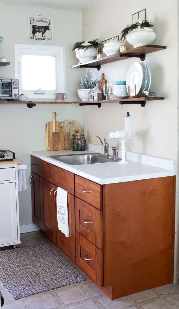 love your dark kitchen cabinets with winter neutrals tiny kitchen with open shelving
