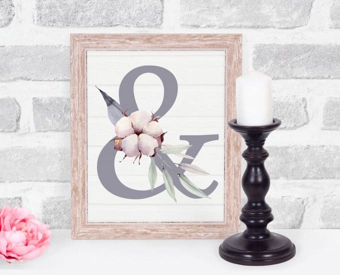 free mothers day monogram printable letter ampersand on brick background with black candlestick