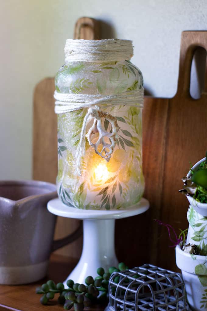 fresh spring vignette with coordinating tealight holder and terra cotta mini pots