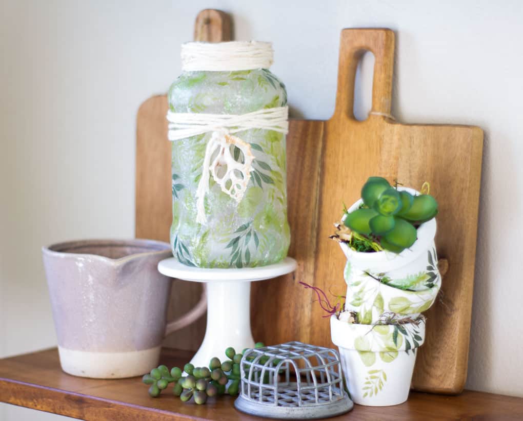 fresh spring vignette with coordinating tealight holder and terra cotta mini pots