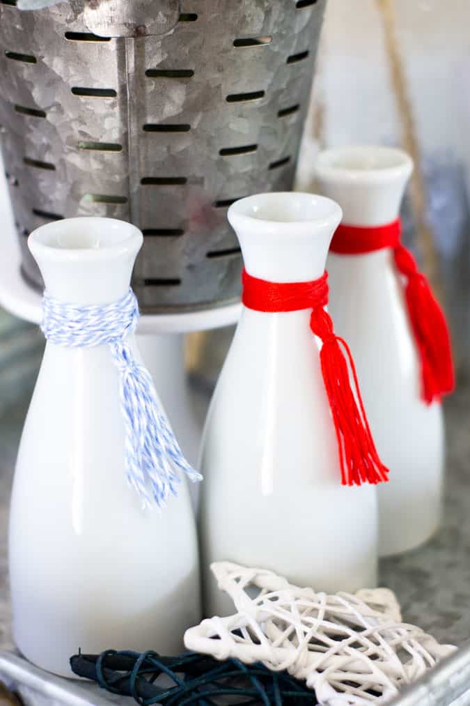 understated patriotic vignette white bottles with red white and blue tassels