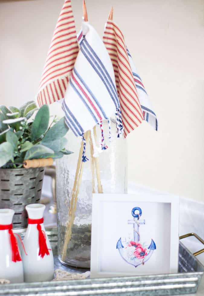 tray with anchor photo and glass bottle with flags