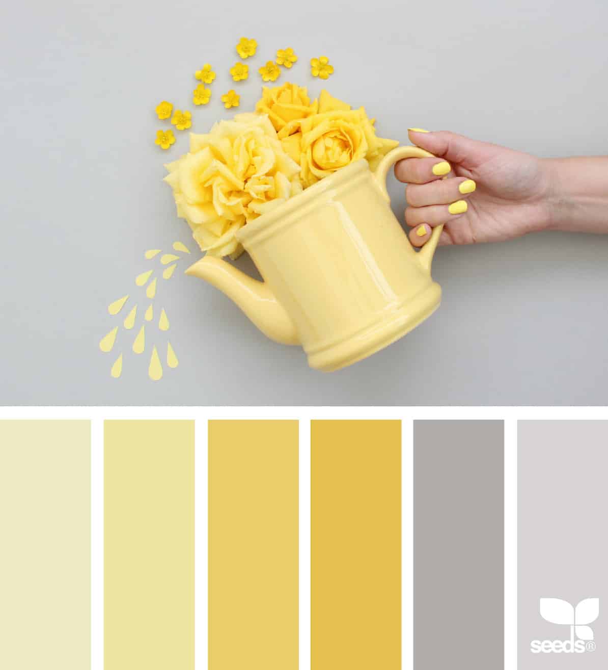 yellow watering can with yellow flowers being poured out by a hand