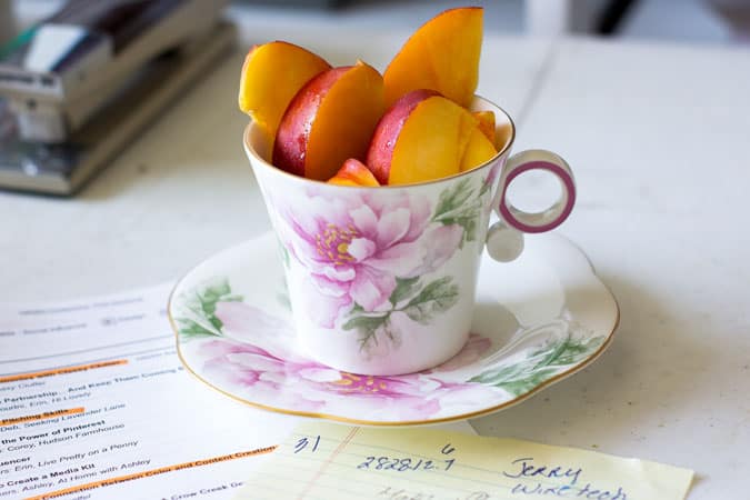 so cal traveling teacup with sliced nectarines inside 