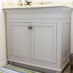 diy painted bathroom cabinets in gray with cream countertop