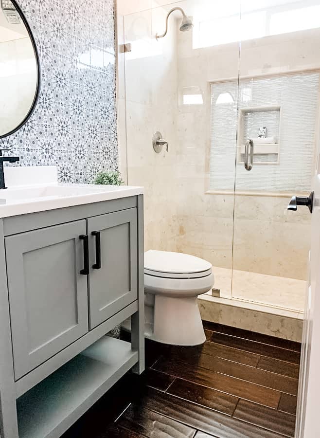 tuesday turn about home renos bathroom with shower vanity mirrow and toilet and tiled wall