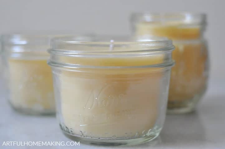 small mason jars with yellow candles