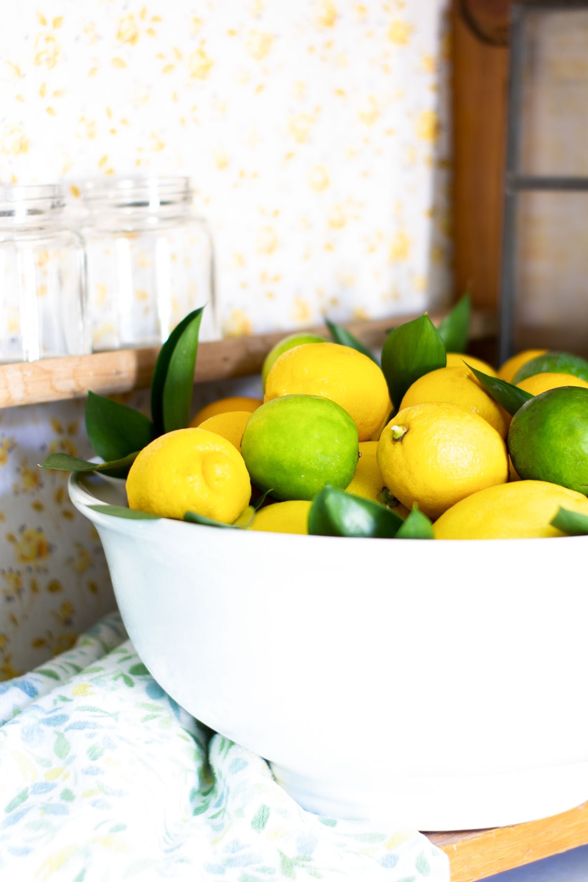 apartment summer decor tips lemons and limes in ironstone bowl