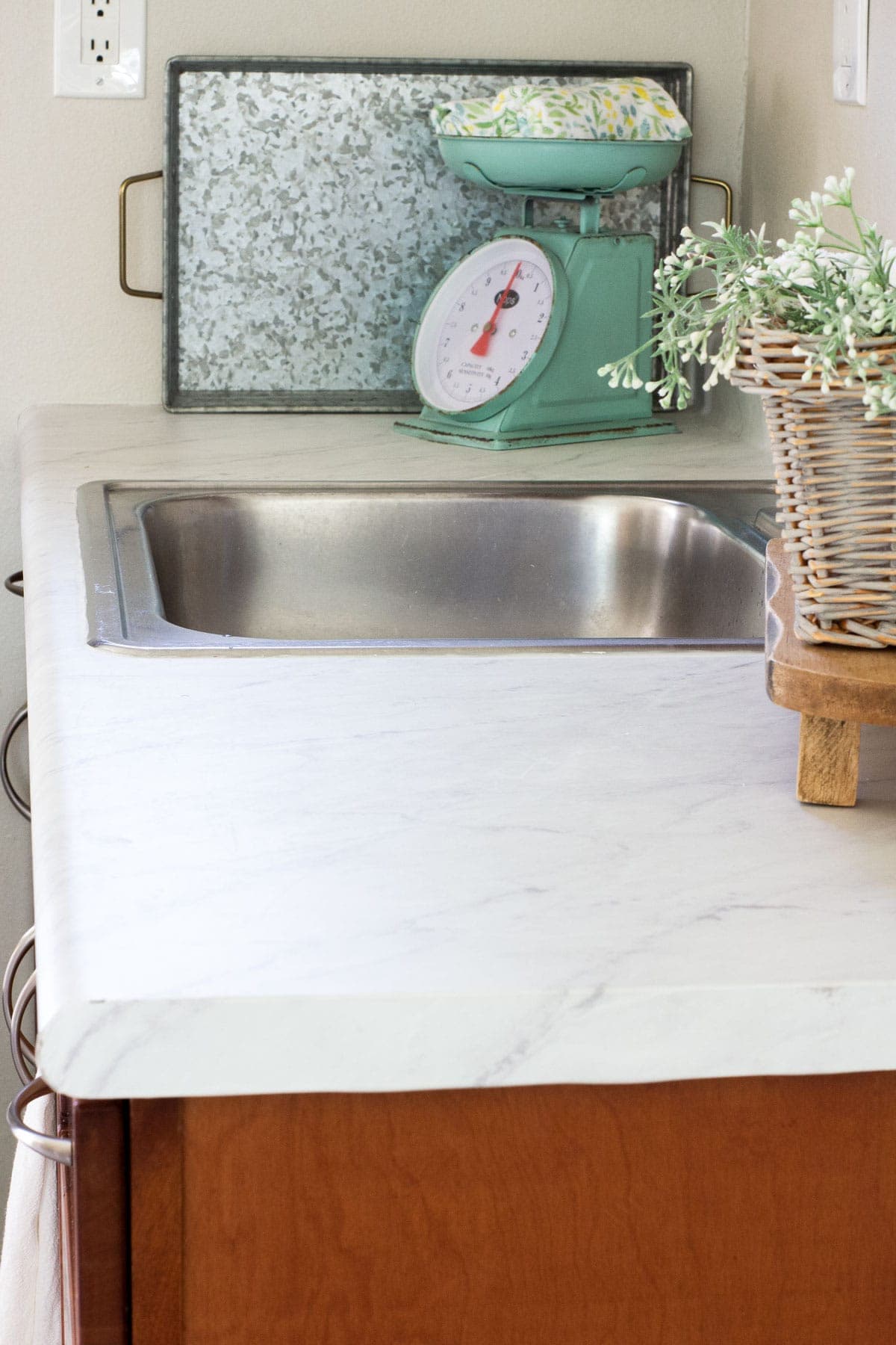 kitchen counter with decor and faux marble