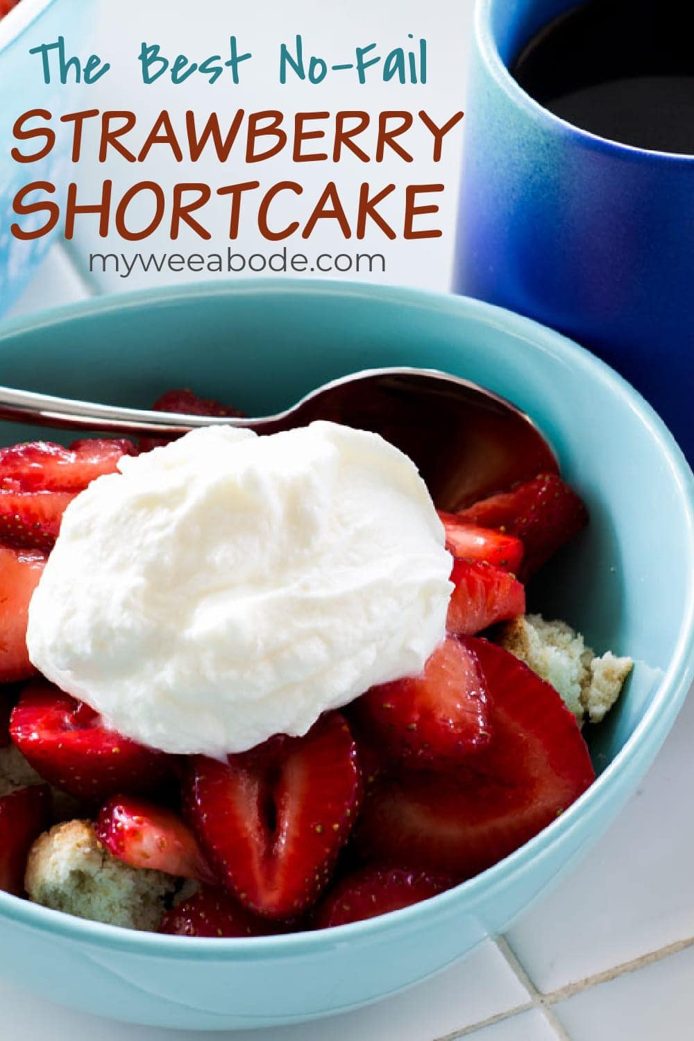 easy no fail strawberry shortcake in aqua bowl on tile counter with blue coffee cup