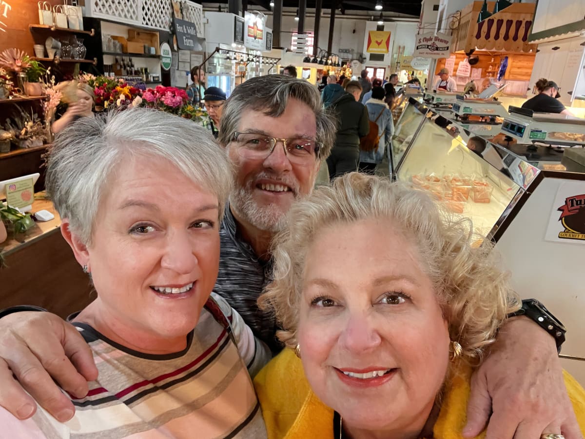 photo of three dear friends at market