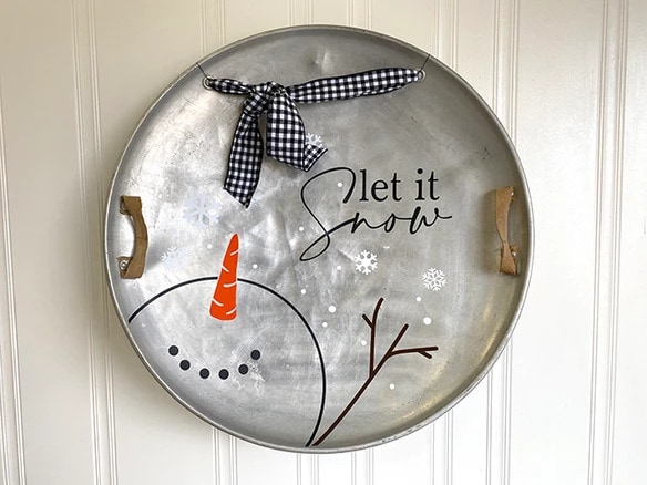 sled disk with winter decor wall hanging