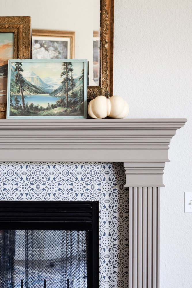 fireplace mantel and stenciled tile with decor