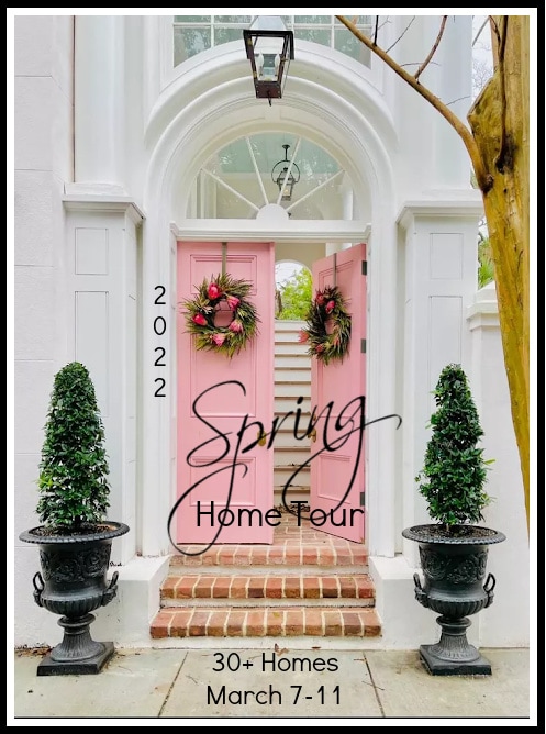small living room update and spring tour pink door with wreaths and trees in urns