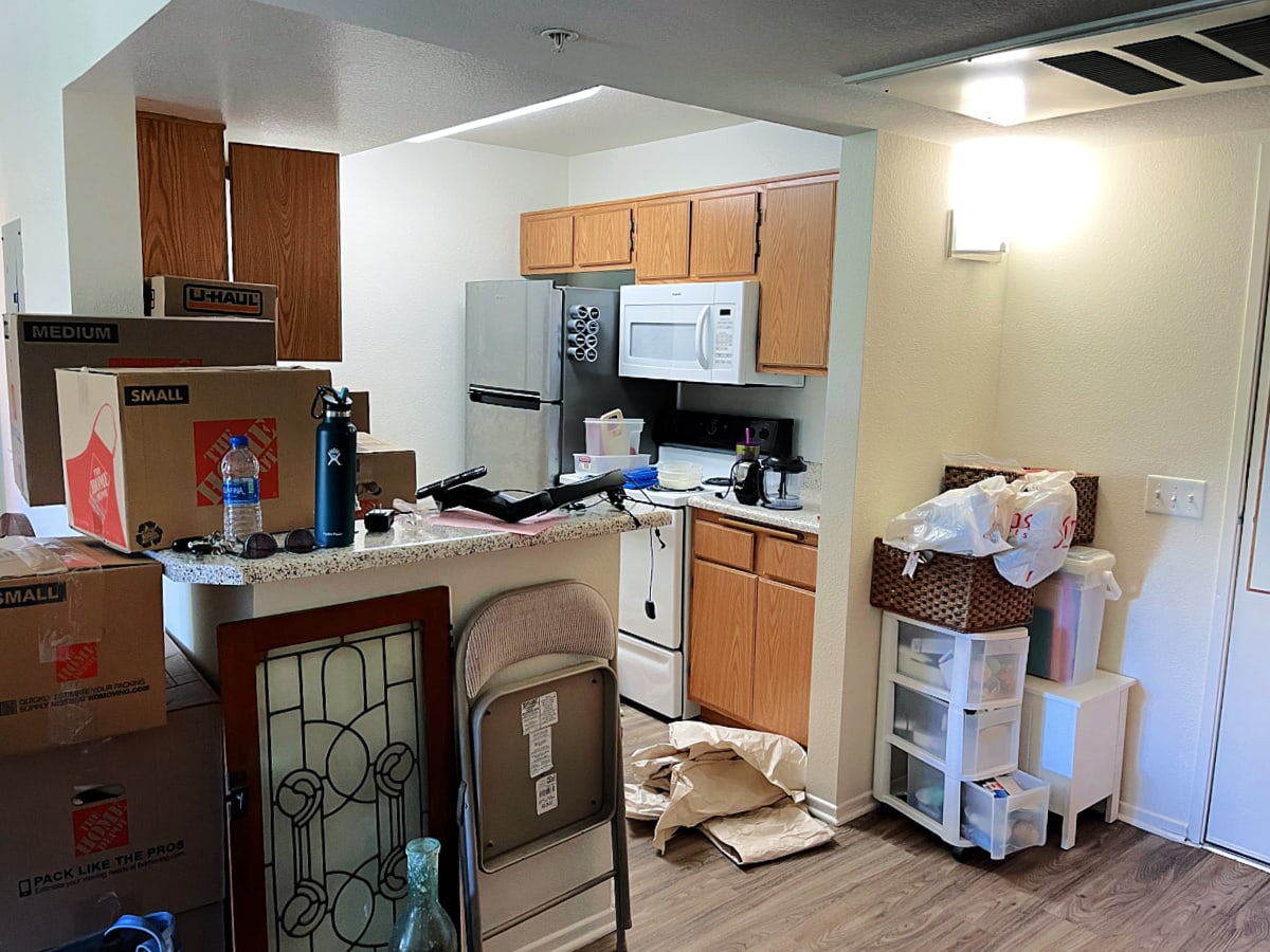 kitchen view with boxes and lots of moving mess