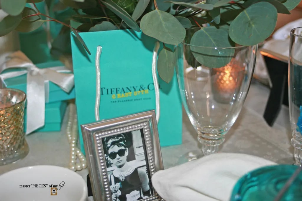 tablescape with photo of audrey hepburn and blue decor