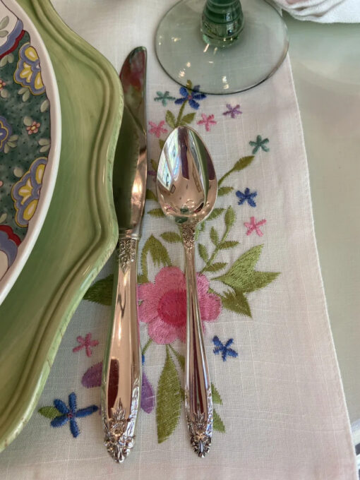 silverware at table setting on vintage placemat