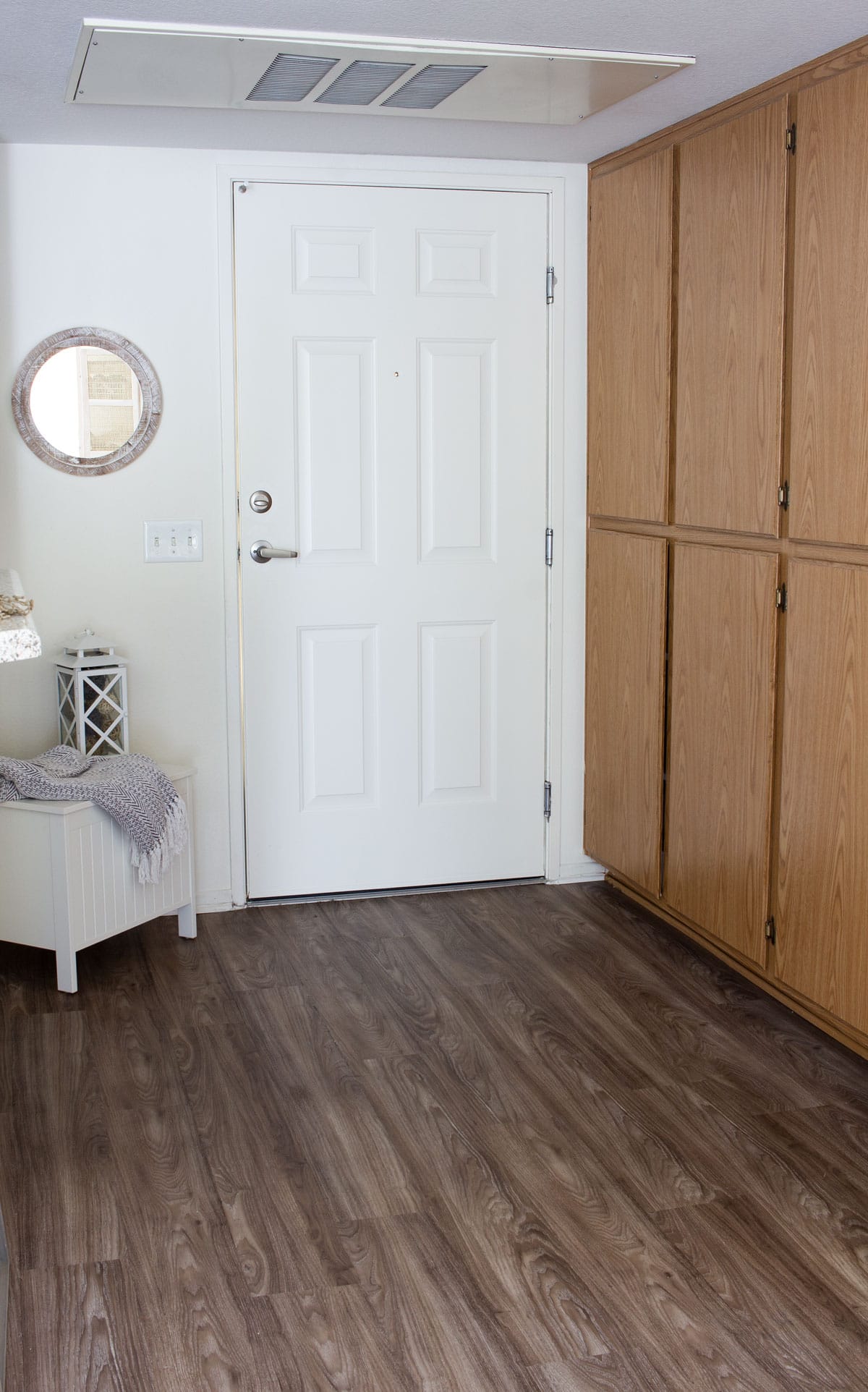 entryway with door pantry wall bench and mirror
