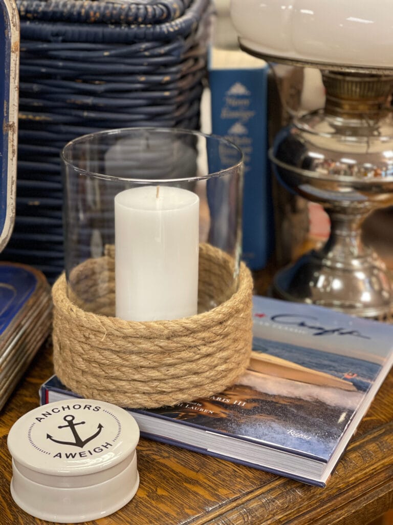 candle in hurricane holder with rope accent and coastal decor