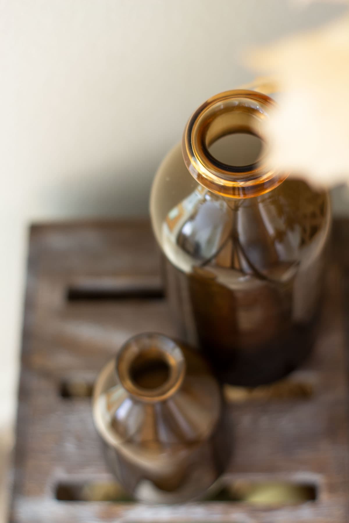 amber bottles on wood surface
