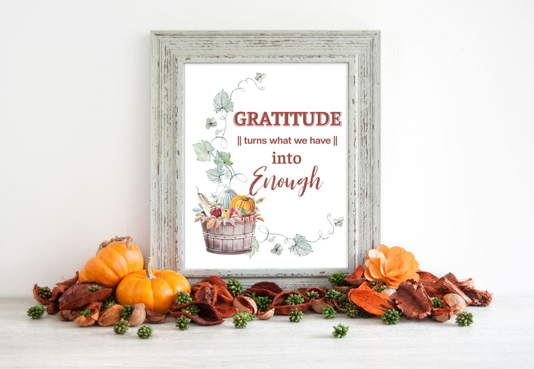 framed thanksgiving printable with pumpkins and fall florals on white surface