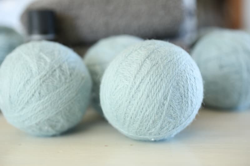 blue wool dryer balls on white surface