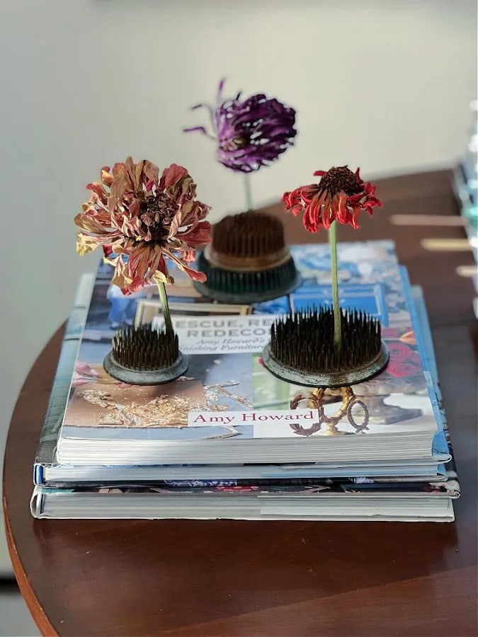 tuesday turn about 174 seasonal kitchens dried flowers in flower frogs on stack of books