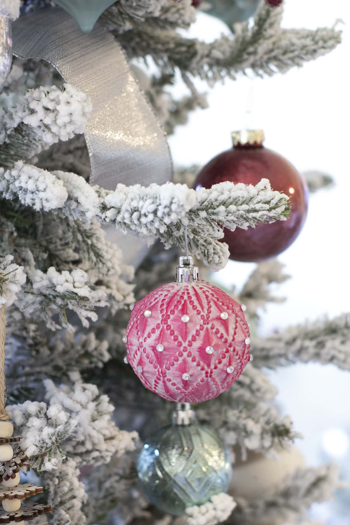 red ornaments with rhinestones in christmas tree