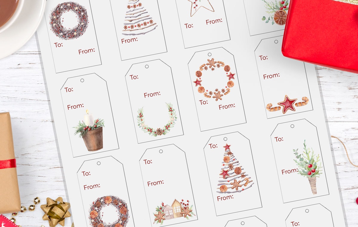 free watercolor christmas gift tags merry and sweet wooden surface with christmas wrapping elements and gifts tags