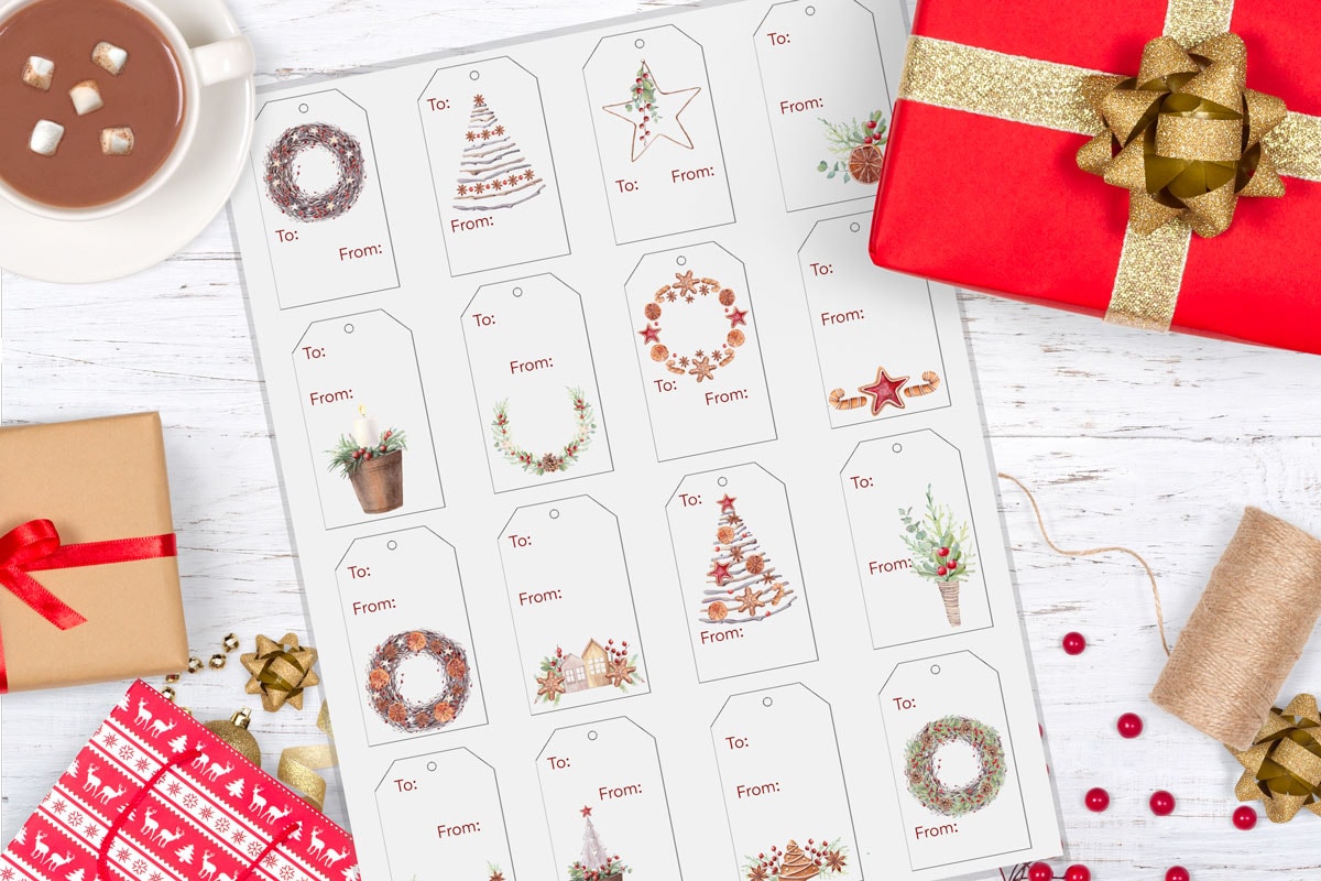 wooden surface with christmas wrapping elements and gifts tags