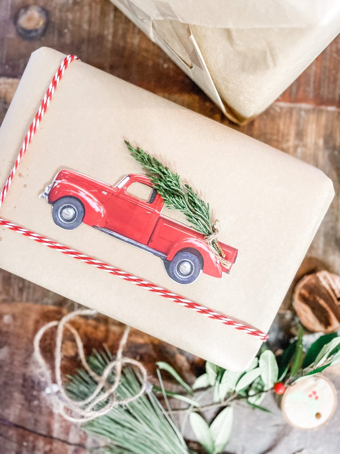 Christmas gift with red truck and greenery
