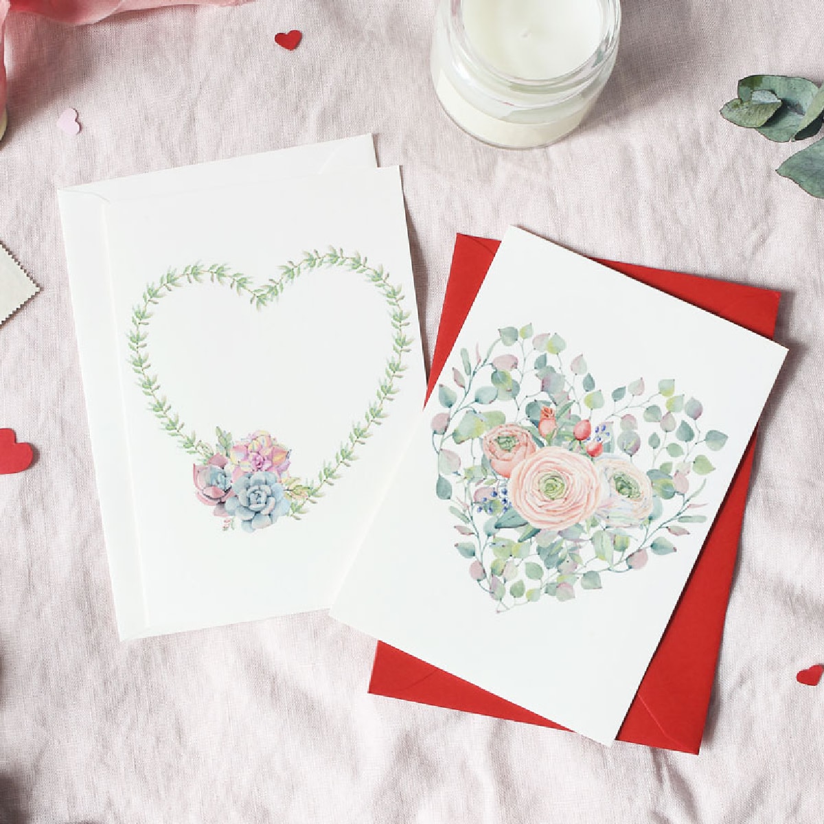 heart cards on linen surface with ribbon red hearts and candle